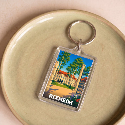 Porte-clés souvenir de la ville de Rixheim avec une illustration stylisée.