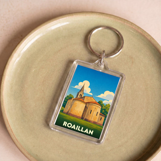 Porte-clés souvenir de la ville de Roaillan avec une illustration stylisée de son église.