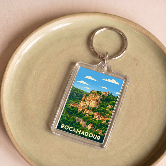 Porte-clés souvenir de la ville de Rocamadour avec une illustration stylisée.