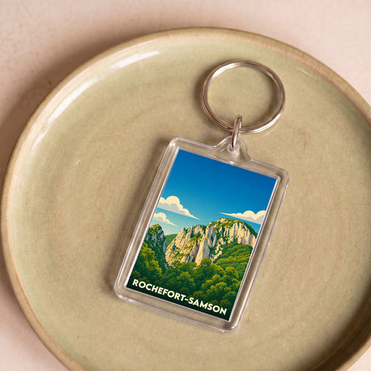 Porte-clés souvenir de la ville de Rochefort-Samson avec une illustration stylisée.