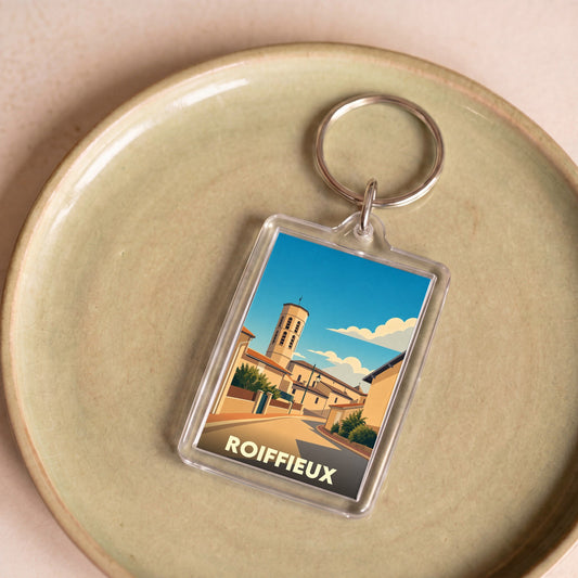 Porte-clés souvenir de la ville de Roiffieux avec une illustration stylisée.