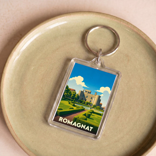 Porte-clés souvenir de la ville de Romagnat avec une illustration stylisée de son château.