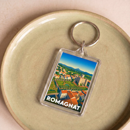 Porte-clés souvenir de la ville de Romagnat avec une illustration stylisée.