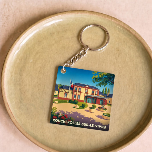 Porte-clés souvenir de la ville de Roncherolles-sur-le-Vivier avec une illustration stylisée de sa mairie.