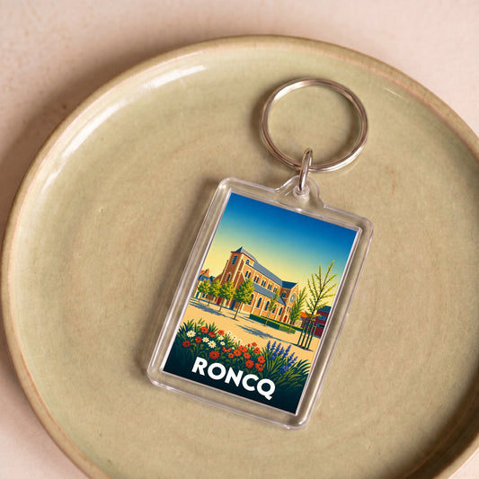 Porte-clés souvenir de la ville de Roncq avec une illustration stylisée.