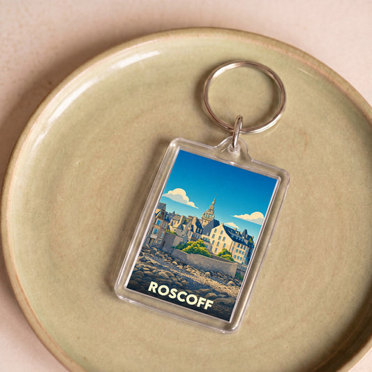 Porte-clés souvenir de la ville de Roscoff avec une illustration stylisée.