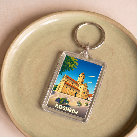 Porte-clés souvenir de la ville de Rosheim avec une illustration stylisée de son église romane.