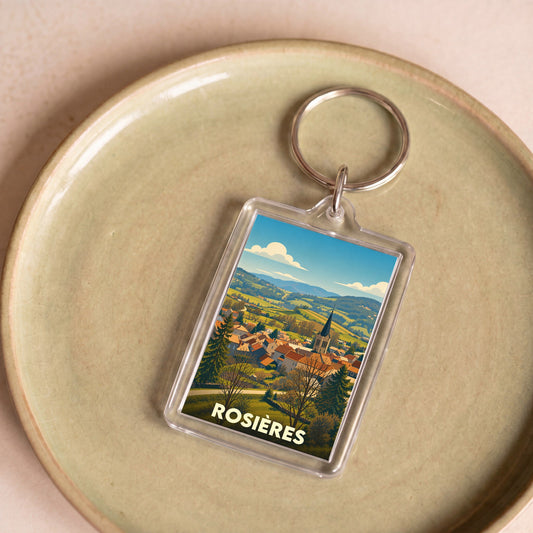 Porte-clés souvenir de la ville de Rosières avec une illustration stylisée de son paysage et de son église.