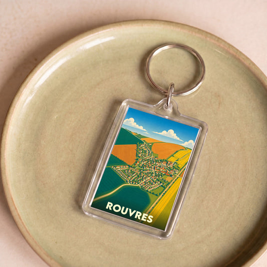 Porte-clés souvenir de la ville de Rouvres avec une illustration stylisée.