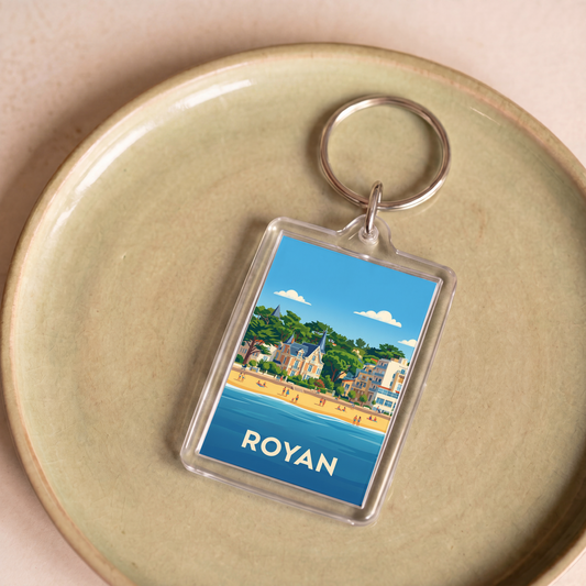 Porte-clés souvenir de la ville de Royan avec une illustration stylisée de son bord de mer.