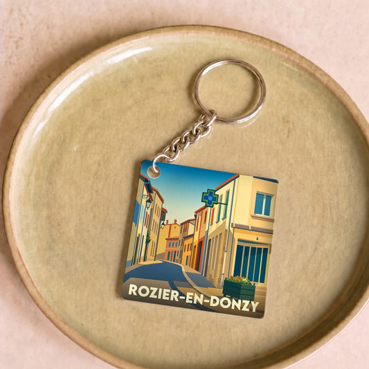 Porte-clés souvenir de la ville de Rozier-en-Donzy avec une illustration stylisée.