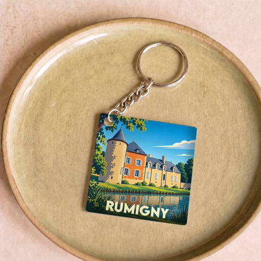 Porte-clés souvenir de la ville de Rumigny avec une illustration stylisée de son château.