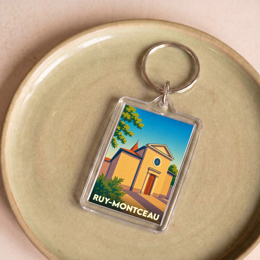 Porte-clés souvenir de la ville de Ruy-Montceau avec une illustration stylisée de son église.