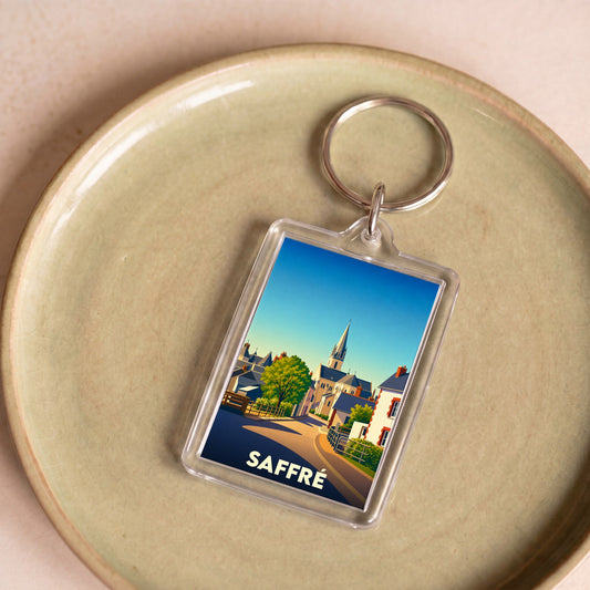 Porte-clés souvenir de la ville de Saffré avec une illustration stylisée.
