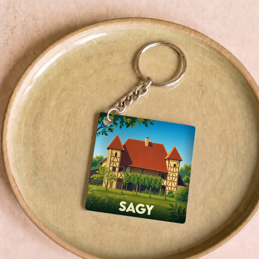 Porte-clés souvenir de la ville de Sagy avec une illustration stylisée.