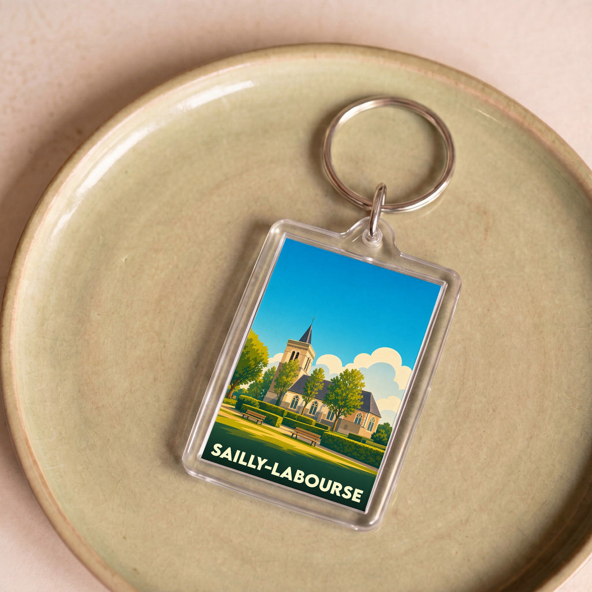 Porte-clés souvenir de la ville de Sailly-Labourse avec une illustration stylisée.