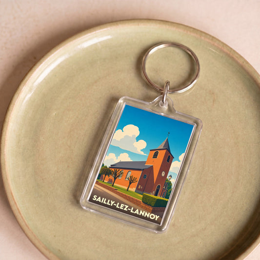 Porte-clés souvenir de la ville de Sailly-lez-Lannoy avec une illustration stylisée de son église.