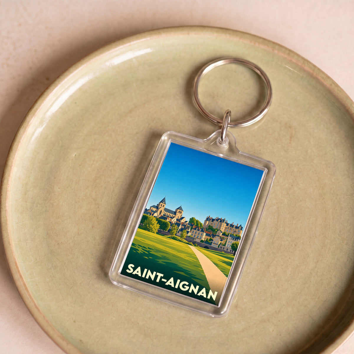 Porte-clés souvenir de la ville de Saint-Aignan avec une illustration stylisée.