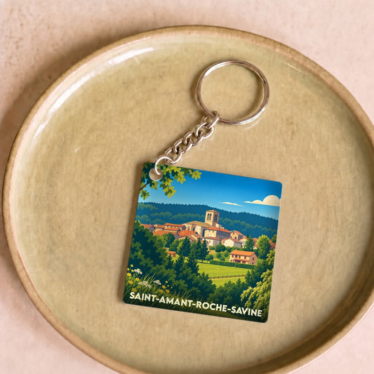 Porte-clés souvenir de la ville de Saint-Amant-Roche-Savine avec une illustration stylisée.