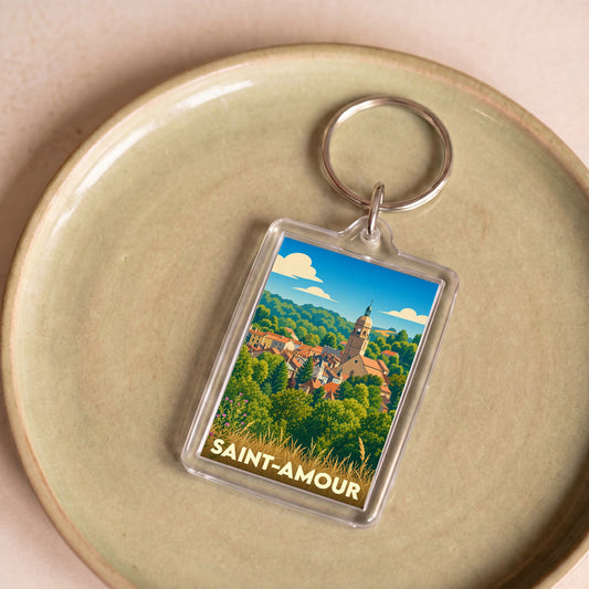 Porte-clés souvenir de la ville de Saint-Amour avec une illustration stylisée.
