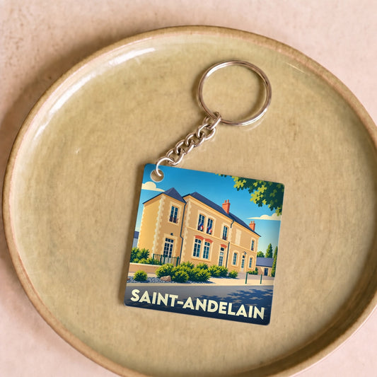 Porte-clés souvenir de la ville de Saint-Andelain avec une illustration stylisée.