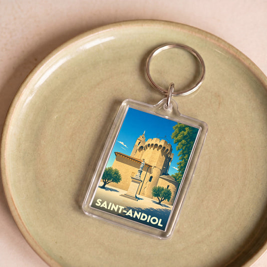 Porte-clés souvenir de la ville de Saint-Andiol avec une illustration stylisée.