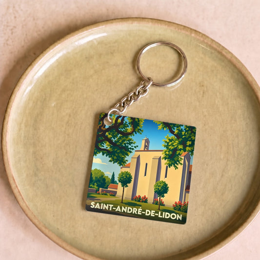 Porte-clés souvenir de la ville de Saint-André-de-Lidon avec une illustration stylisée de son église.