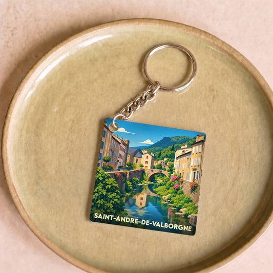 Porte-clés souvenir de la ville de Saint-André-de-Valborgne avec une illustration stylisée d'un pont enjambant une rivière.