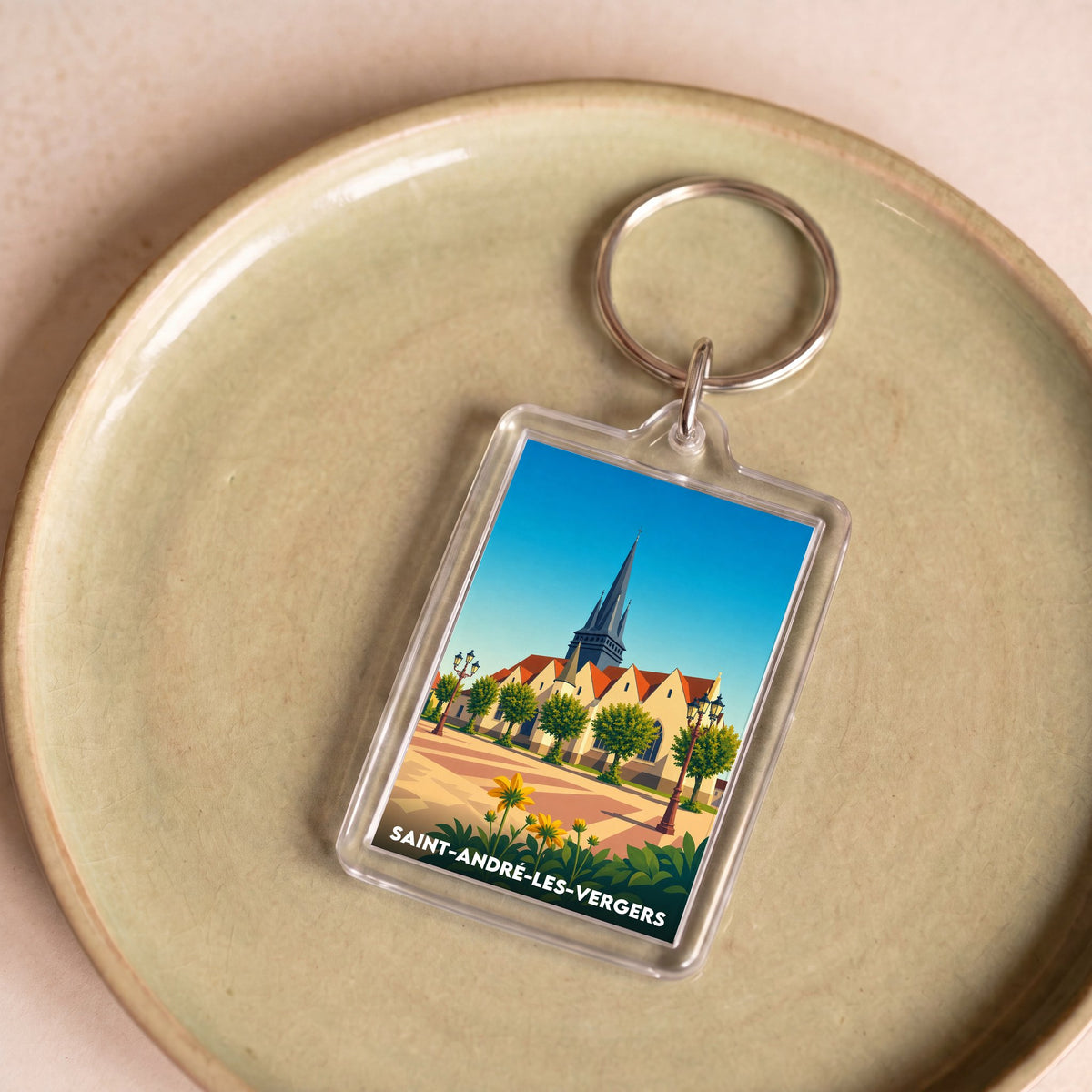 Porte-clés souvenir de la ville de Saint-André-les-Vergers avec une illustration stylisée de son église.