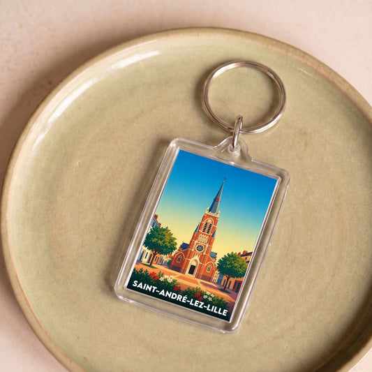 Porte-clés souvenir de la ville de Saint-André-lez-Lille avec une illustration stylisée.