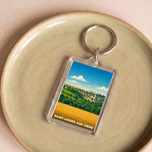 Porte-clés souvenir de la ville de Saint-André-sur-Orne avec une illustration stylisée.