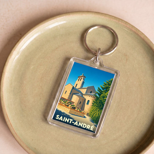Porte-clés souvenir de la ville de Saint-André avec une illustration stylisée d'un monument historique.