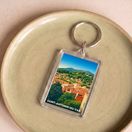 Porte-clés souvenir de la ville de Saint-Antonin-du-Var avec une illustration stylisée.