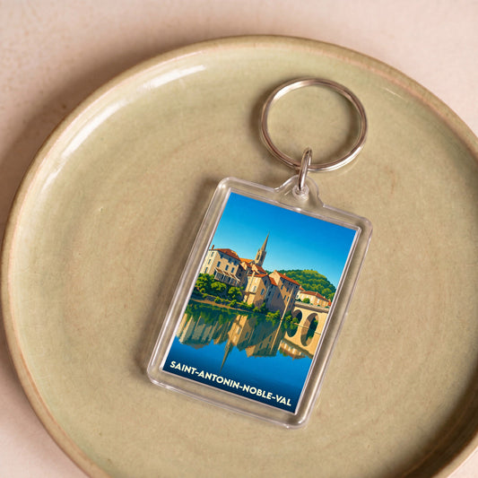 Porte-clés souvenir de la ville de Saint-Antonin-Noble-Val avec une illustration stylisée.