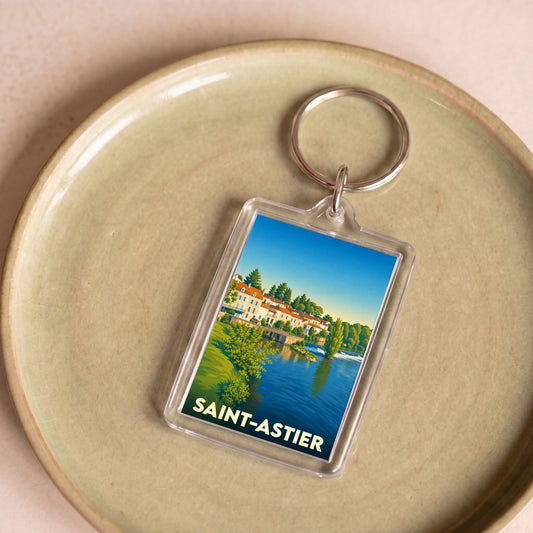 Porte-clés souvenir de la ville de Saint-Astier avec une illustration stylisée.