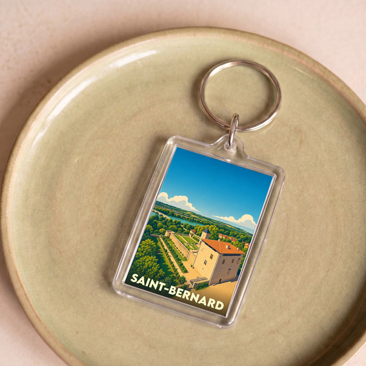 Porte-clés souvenir de la ville de Saint-Bernard avec une illustration stylisée.