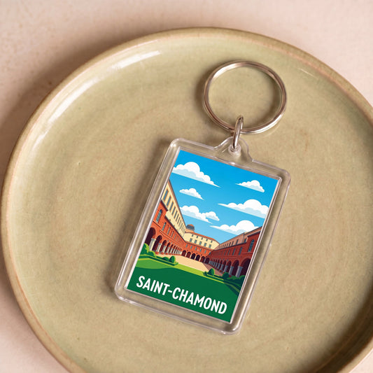 Porte-clés souvenir de la ville de Saint-Chamond avec une illustration stylisée de son architecture.