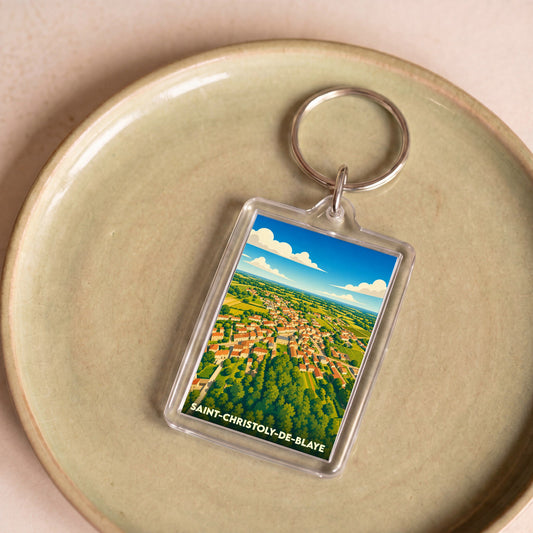 Porte-clés souvenir de la ville de Saint-Christoly-de-Blaye avec une illustration stylisée vue du ciel.
