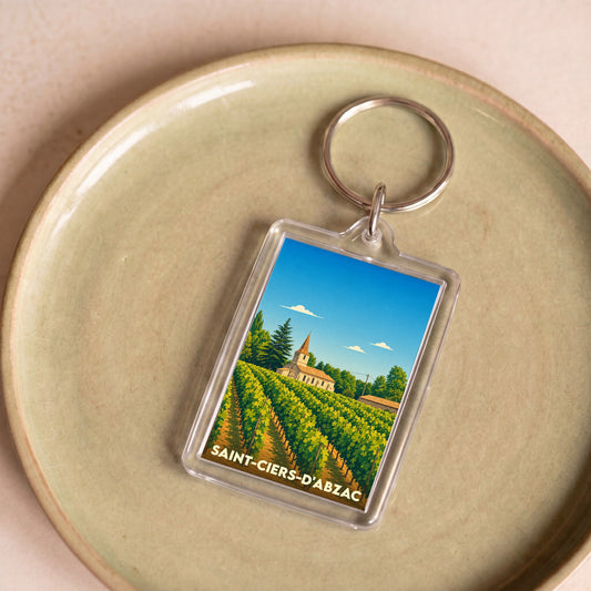 Porte-clés souvenir de la ville de Saint-Ciers-d'Abzac avec une illustration stylisée de ses vignobles et de son église.
