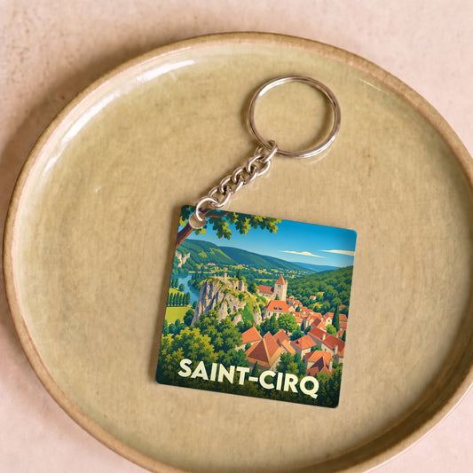 Porte-clés souvenir de la ville de Saint-Cirq avec une illustration stylisée.