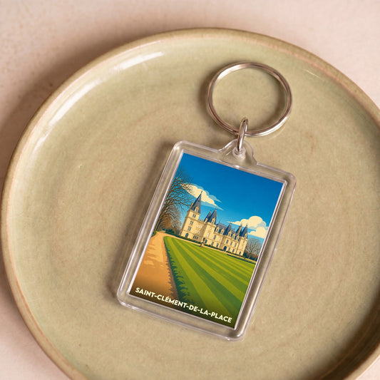 Porte-clés souvenir de la ville de Saint-Clément-de-la-Place avec une illustration stylisée de son château.