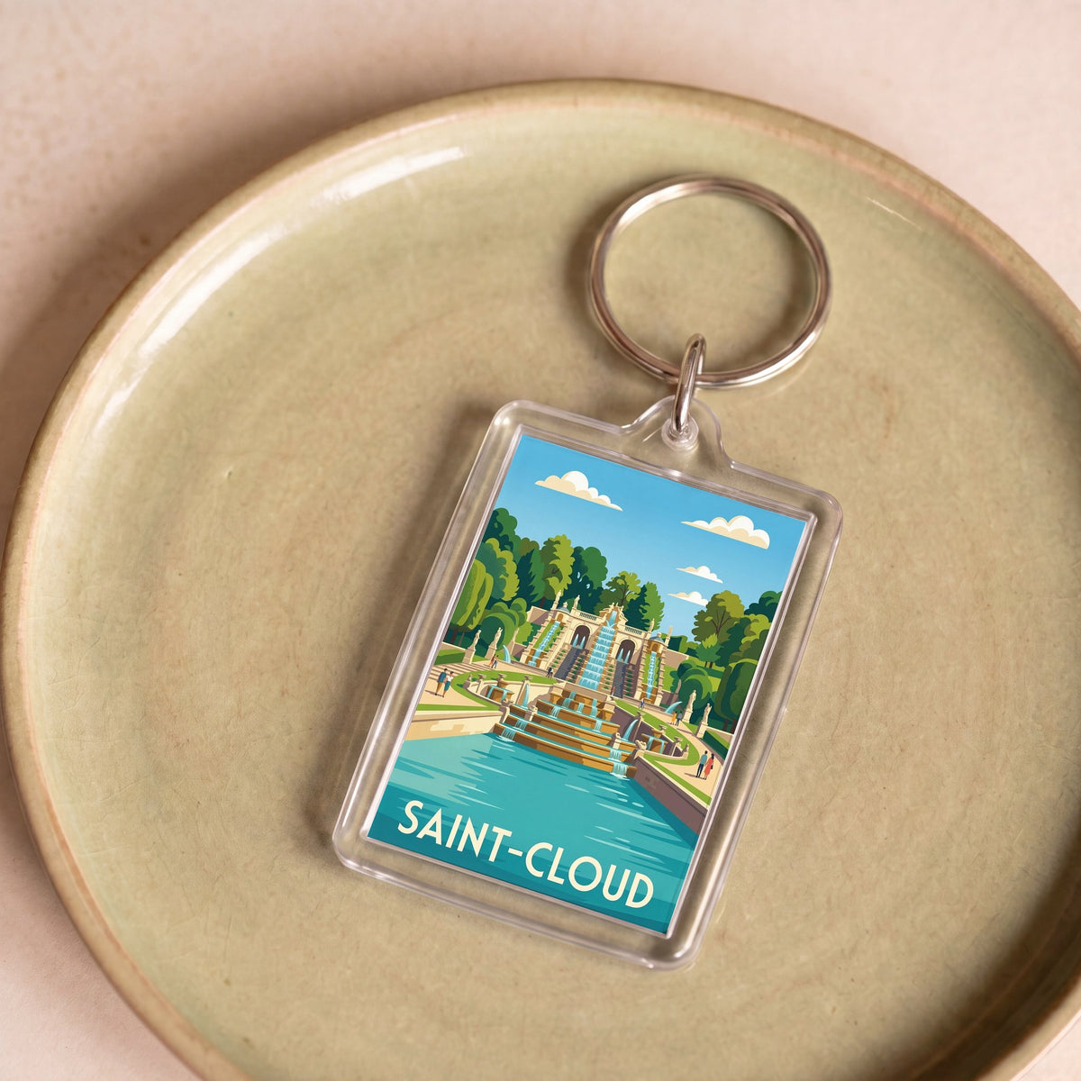 Porte-clés souvenir de la ville de Saint-Cloud avec une illustration stylisée.