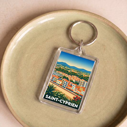 Porte-clés souvenir de la ville de Saint-Cyprien avec une illustration stylisée.
