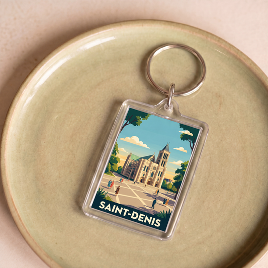 Porte-clés souvenir de la ville de Saint-Denis avec une illustration stylisée de sa basilique.