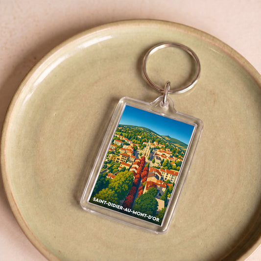 Porte-clés souvenir de la ville de Saint-Didier-au-Mont-d'Or avec une illustration stylisée.