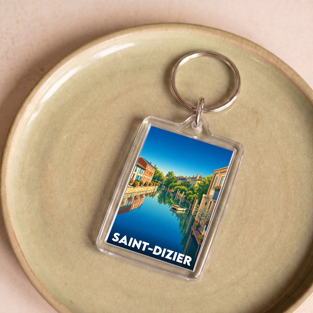 Porte-clés souvenir de la ville de Saint-Dizier avec une illustration stylisée.
