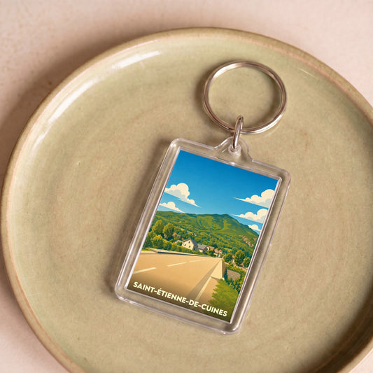 Porte-clés souvenir de la ville de Saint-Étienne-de-Cuines avec une illustration stylisée.