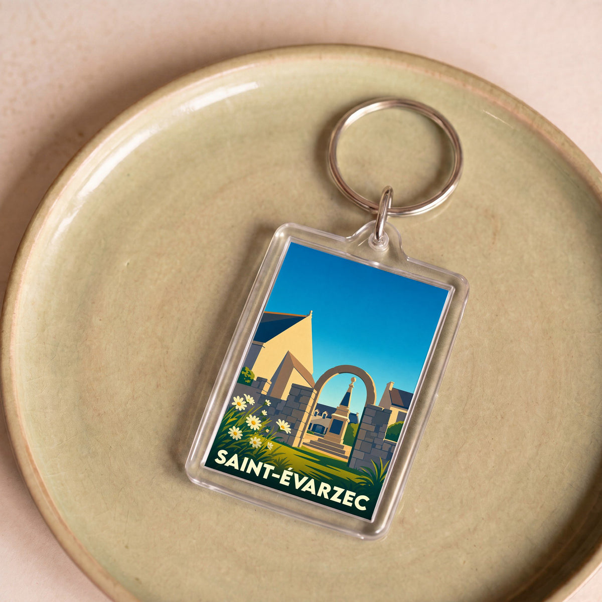 Porte-clés souvenir de la ville de Saint-Évarzec avec une illustration stylisée.