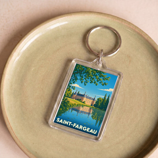 Porte-clés souvenir de la ville de Saint-Fargeau avec une illustration stylisée de son château et de son étang.