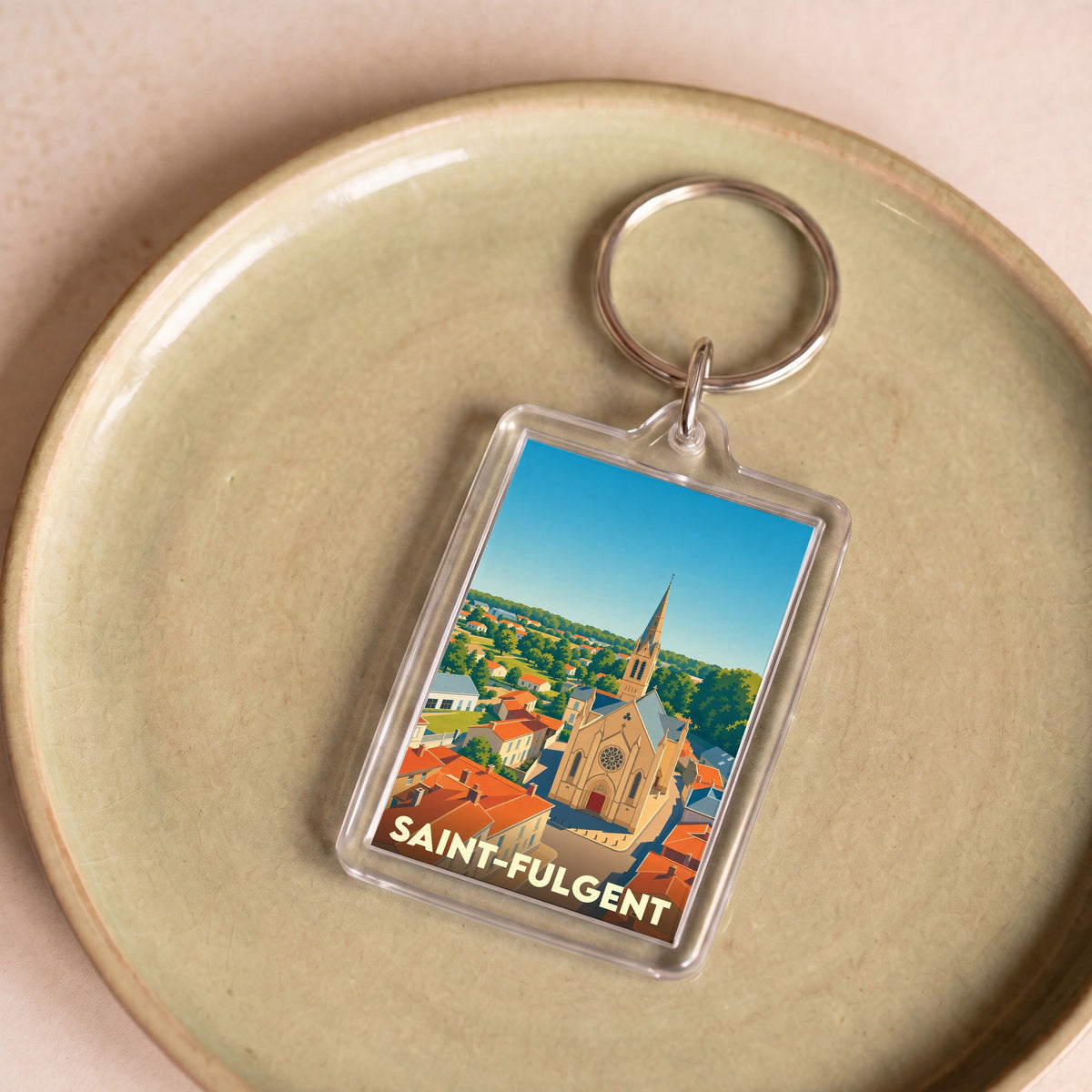 Porte-clés souvenir de la ville de Saint-Fulgent avec une illustration stylisée.